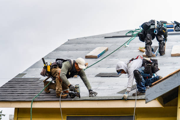 Professional Gutter Installation technician working in Hudson, MA